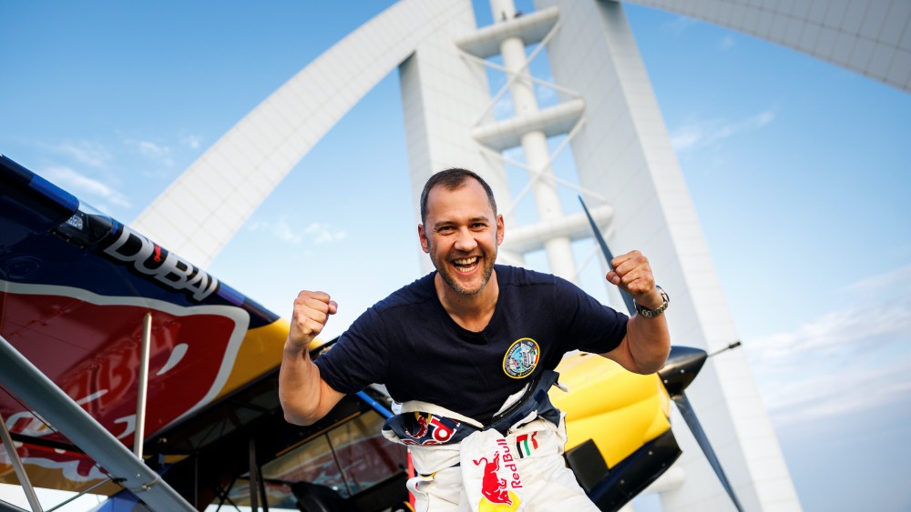 A Red Bull Air Racing pilot lands his aircraft on the Burj Al Arab Jumeirah in Dubai.