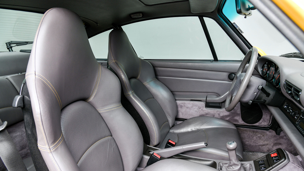 The gray leather interior of a 1996 Porsche 911 Turbo.