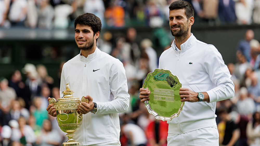 LONDON, ENGLAND - JULY 16: Carlos Alcaraz of Spain and Novak Djokovic of Serbia pose with their trophies after the final of the men's singles during day fourteen of The Championships Wimbledon 2023 at All England Lawn Tennis and Croquet Club on July 16, 2023 in London, England. (Photo by Frey/TPN/Getty Images)