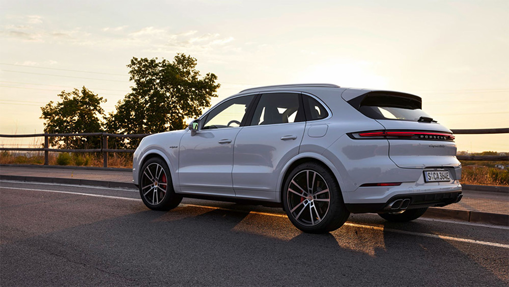 A rear 3/4 view of the 2024 Porsche Cayenne Turbo E-Hybrid