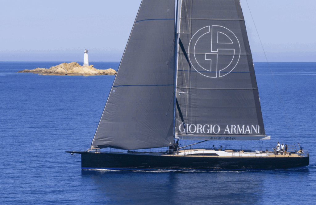 Sorvind by Giorgio Armani with the island of Monaci in the background, Giorgio Armani Superyacht Regatta 2025